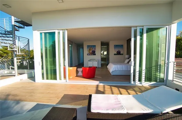 a bedroom with a bed and a night stand