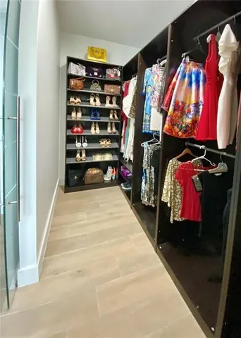 a bathroom with a toilet a sink and shower