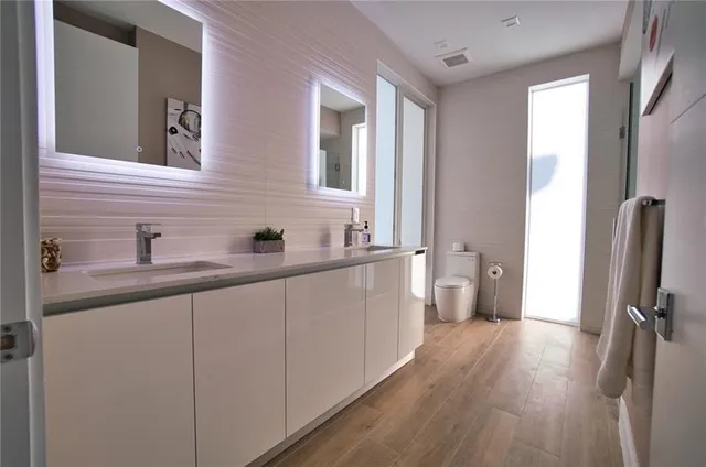 a view of a patio with table and chairs with potted plants