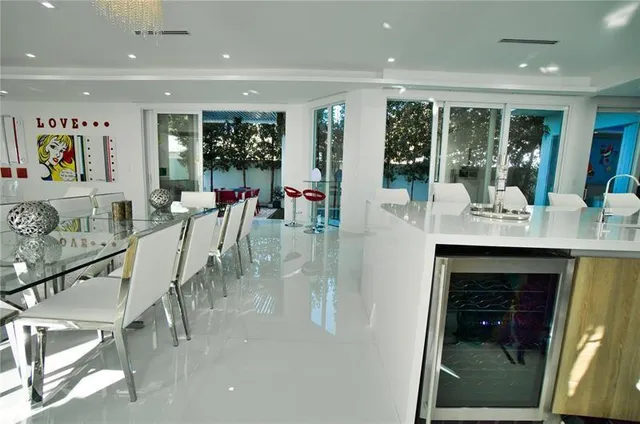 a view of a hallway with furniture and large window