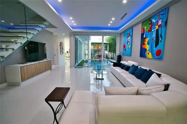 a living room with furniture and a flat screen tv