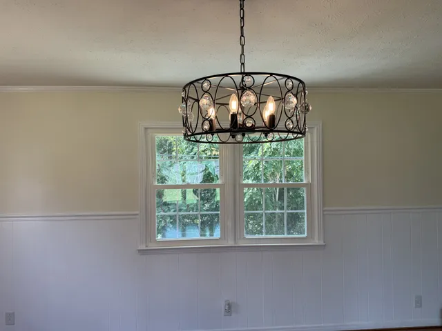 a front view of a house with swimming pool having outdoor seating