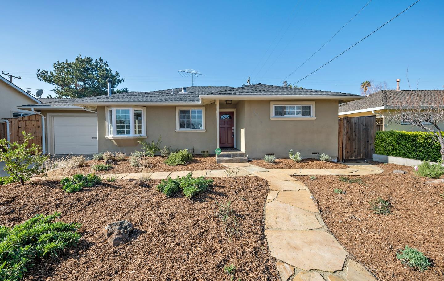 1019 Mango Avenue Sunnyvale, CA 94087 - Photo 1 of 17 a front view of a house with a yard