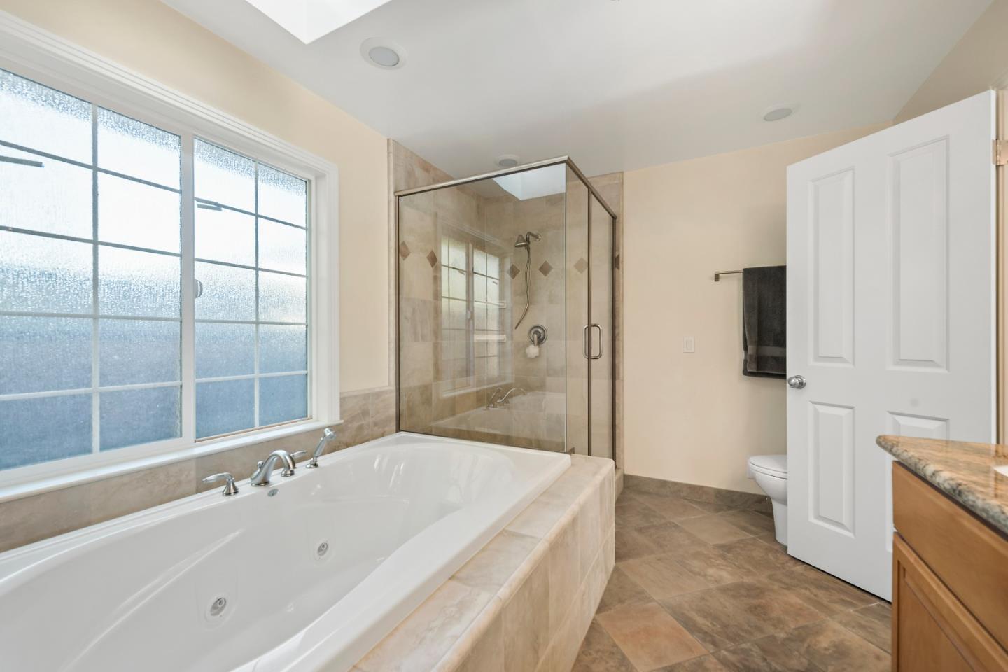 1019 Mango Avenue Sunnyvale, CA 94087 - Photo 15 of 17 a bathroom with a bathtub and a shower