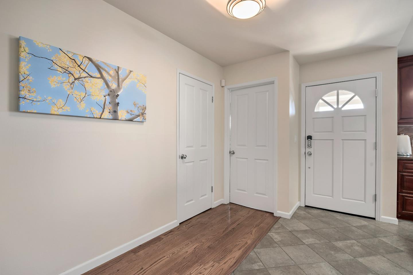 1019 Mango Avenue Sunnyvale, CA 94087 - Photo 3 of 17 a view of an empty room with wooden floor and closet