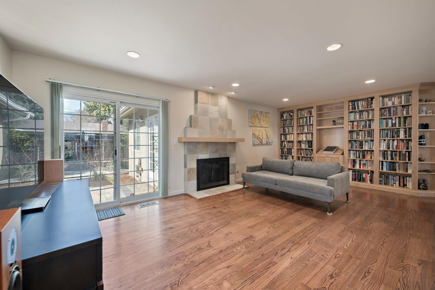 1019 Mango Avenue Sunnyvale, CA 94087 - Photo 4 of 17 a living room with furniture and a fireplace