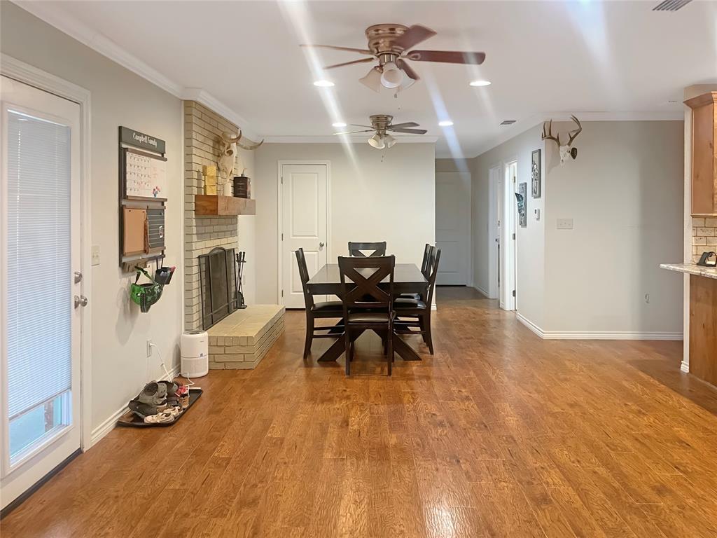 584 Highway 16 Graham, TX 76450 - Photo 10 of 22 a view of a dining room with furniture and rug