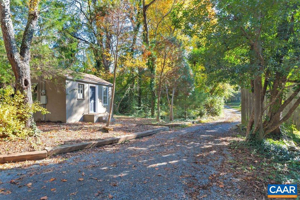 301 Georgetown Lane Charlottesville, VA 22901 - Photo 19 of 39 a view of a house with large tree and wooden fence