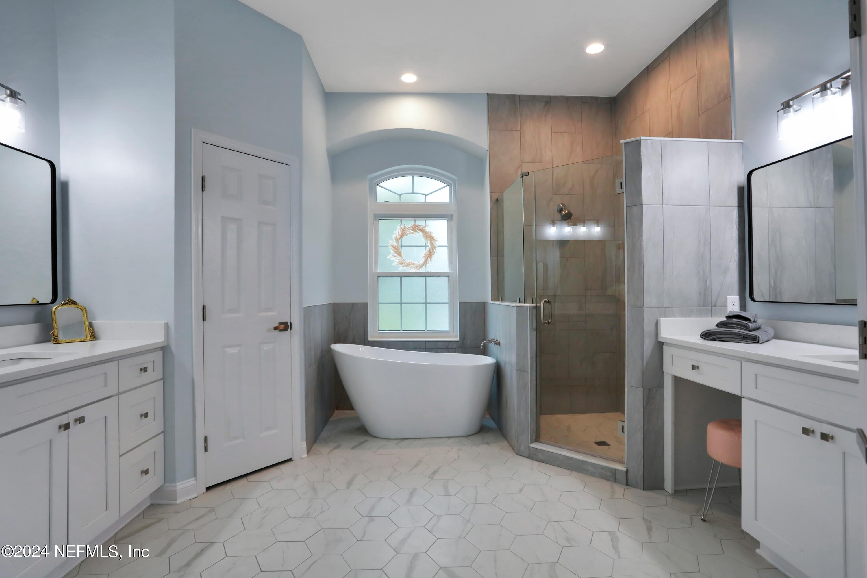 346 Porta Rosa Circle St. Augustine, FL 32092 - Photo 17 of 53 a spacious bathroom with a double vanity sink a large mirror and a shower