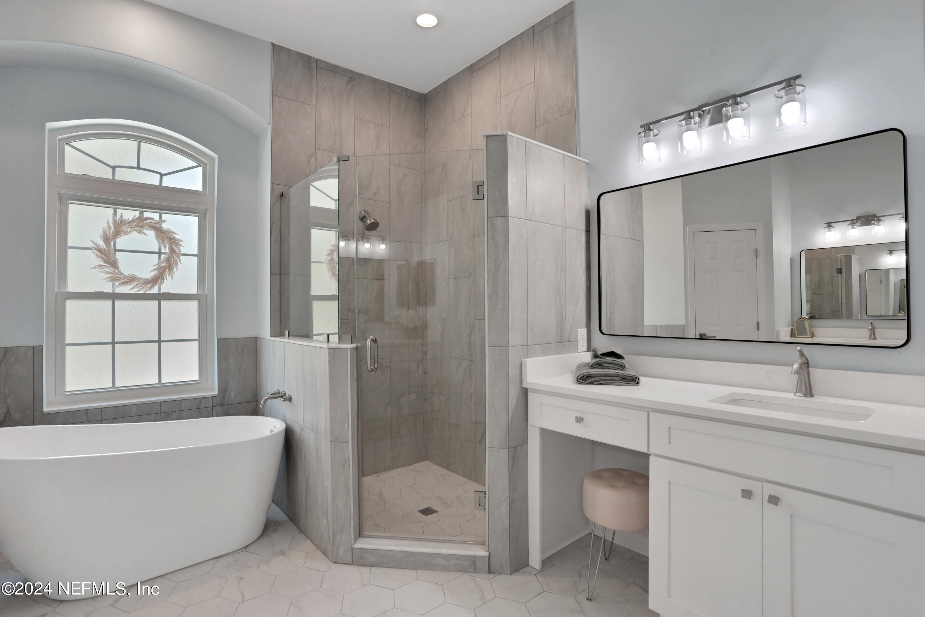 346 Porta Rosa Circle St. Augustine, FL 32092 - Photo 19 of 53 a bathroom with a tub sink shower and mirror