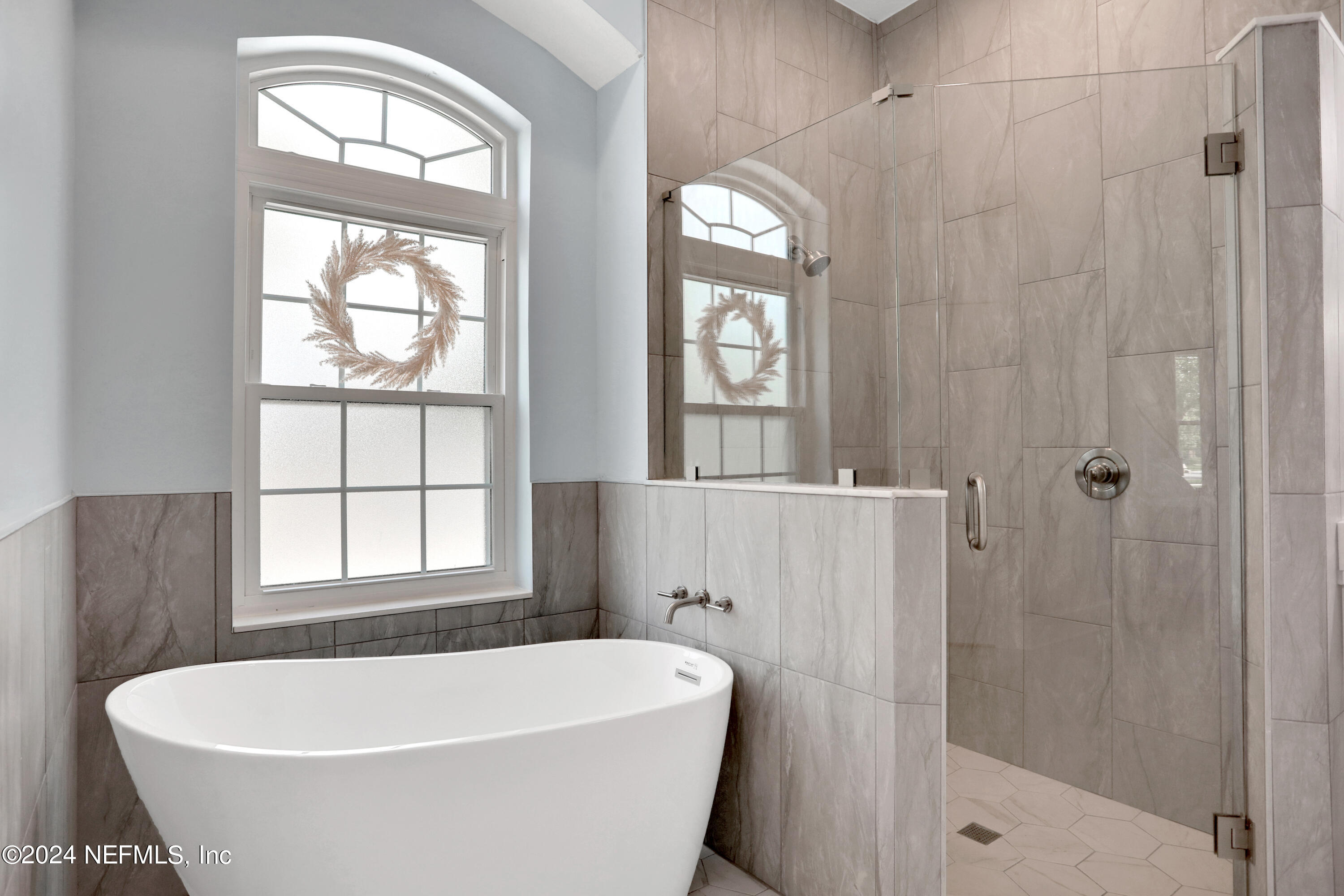 346 Porta Rosa Circle St. Augustine, FL 32092 - Photo 20 of 53 a white bath tub sitting next to a window