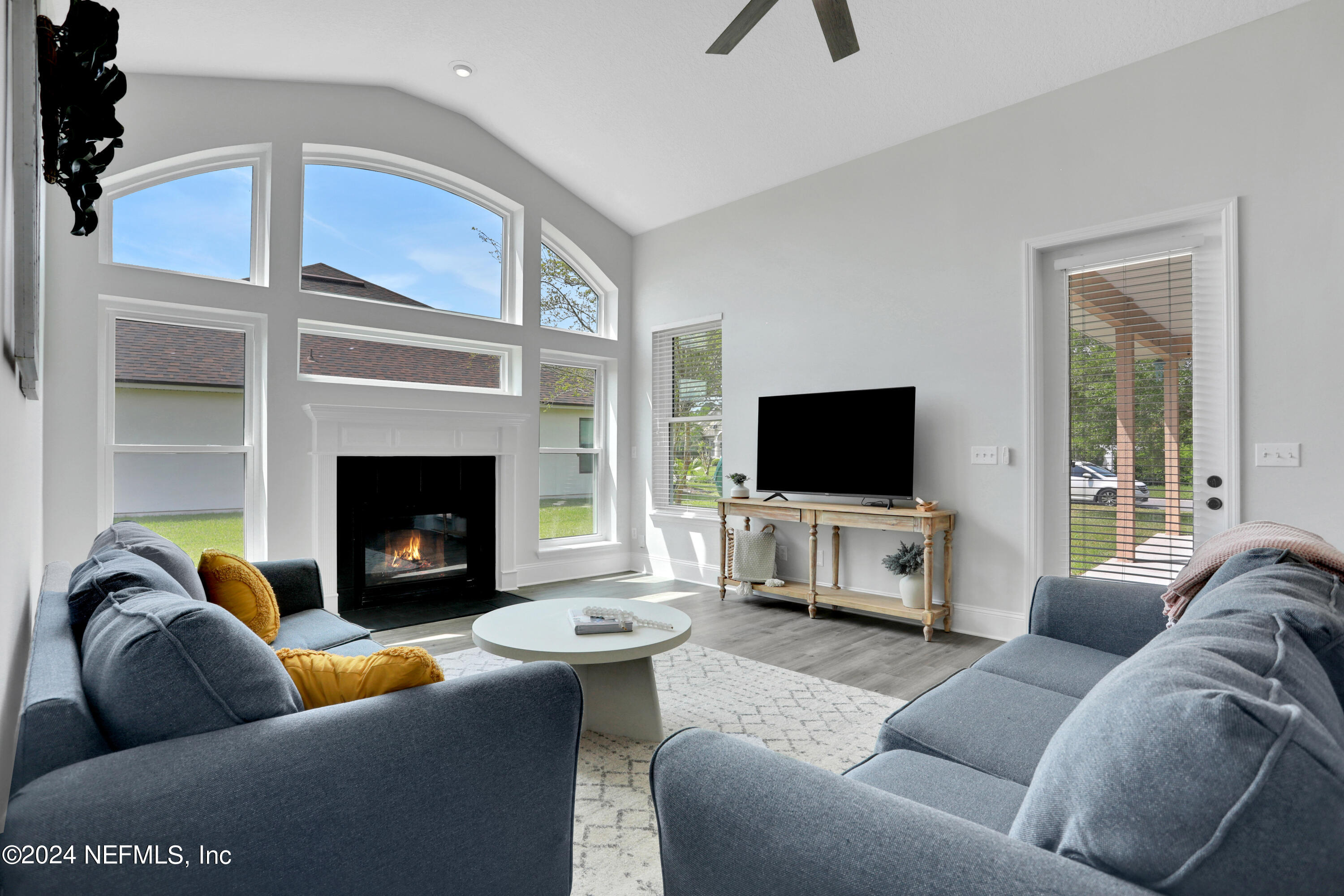 346 Porta Rosa Circle St. Augustine, FL 32092 - Photo 2 of 53 a living room with furniture and a fireplace
