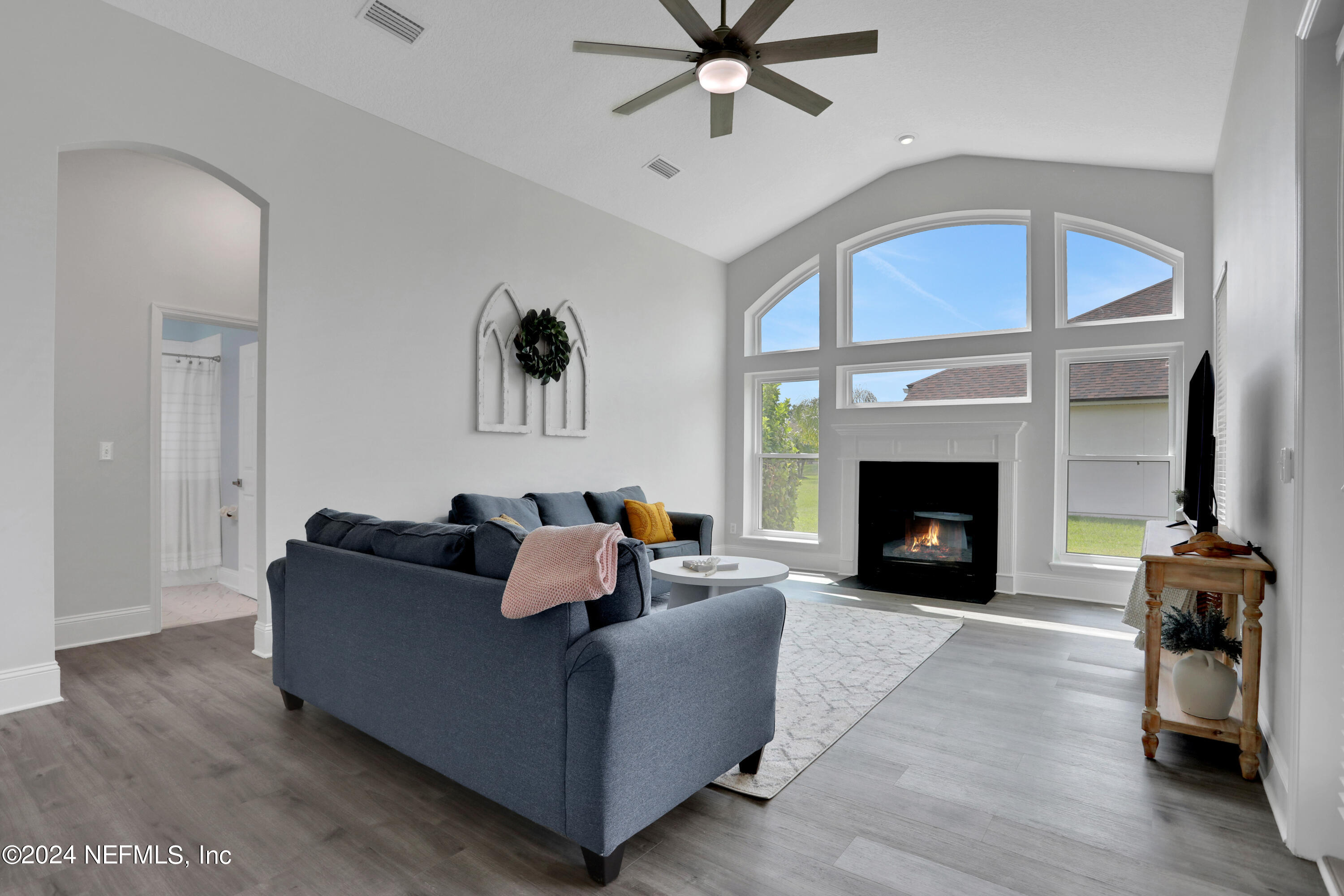346 Porta Rosa Circle St. Augustine, FL 32092 - Photo 27 of 53 a living room with furniture and a fireplace