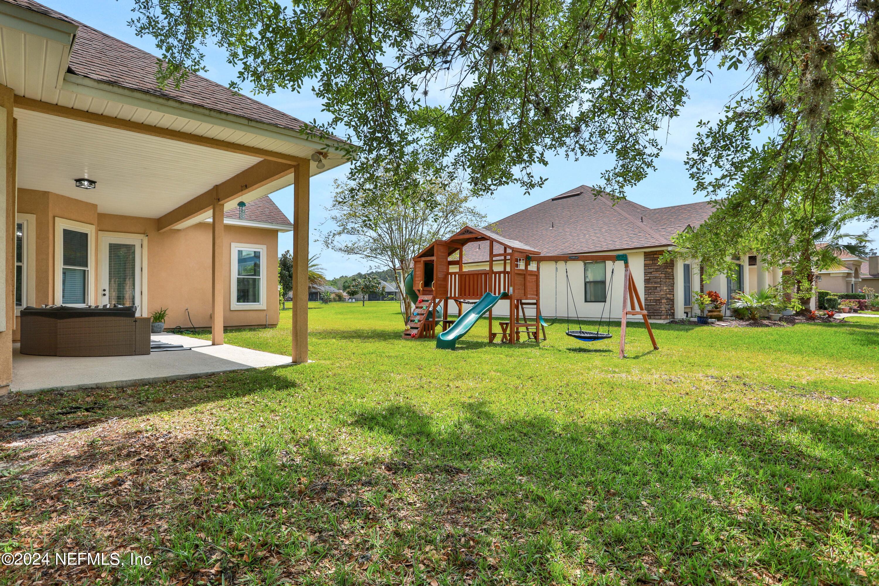 346 Porta Rosa Circle St. Augustine, FL 32092 - Photo 41 of 53 a view of a house with a yard