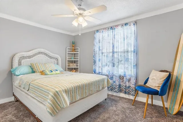 a bedroom with a bed and a chair