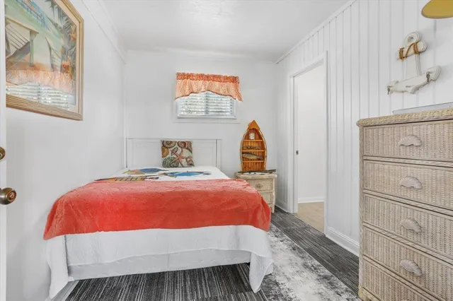 a bedroom with a bed and a cabinets