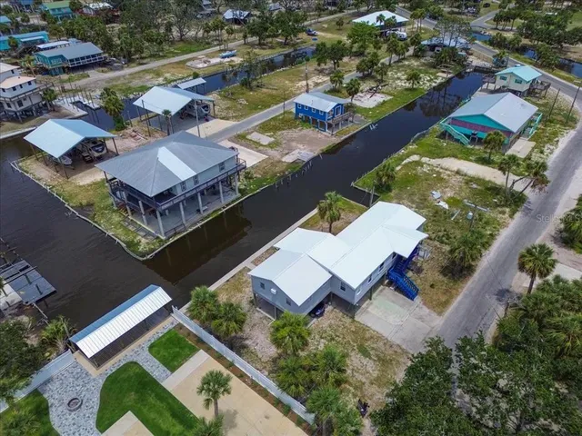 an aerial view of a house with a garden