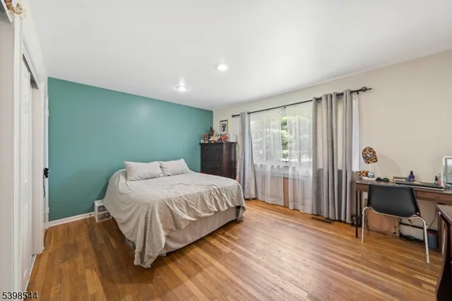 a bedroom with a bed and a table