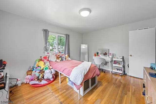 a bed room with a bed and a chair