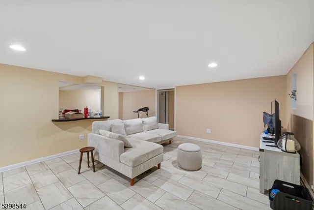 a living room with furniture and a table