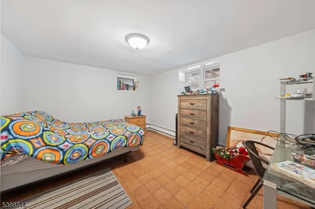 a bedroom with a bed and with furniture