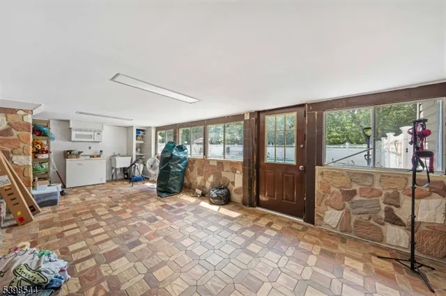 a large bedroom with a large bed and a large window