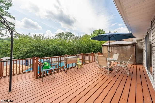 a view of balcony with deck and outdoor seating
