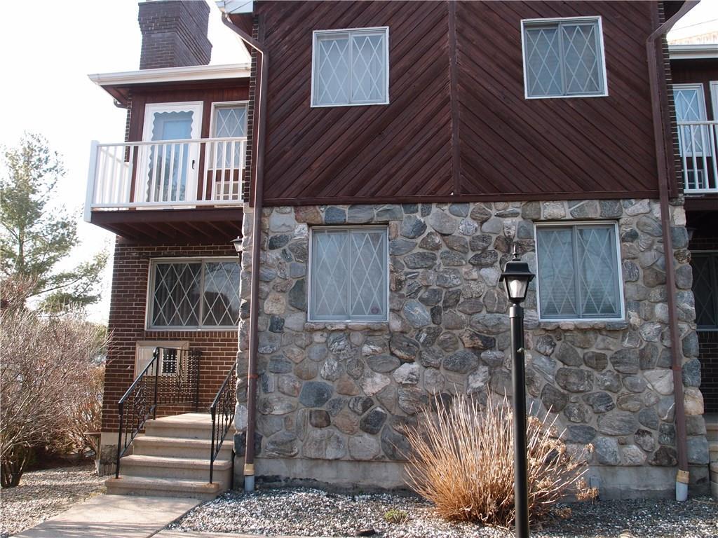 238 Anderson Avenue, Unit 2H Waterbury, CT 06708 - Photo 1 of 1 a front view of a house with parking