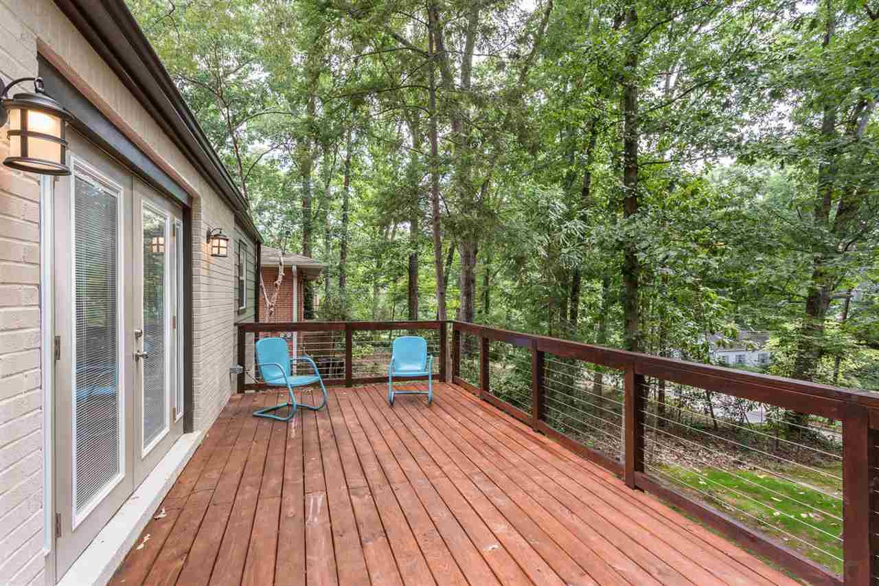 409 Stacy Street Raleigh, NC 27607 - Photo 4 of 25 Taking more inspiration from the wonderful trails of Asheville, this stainless cable railing system on the two-toned deck provides a safe and sturdy alternative that will not block your line of sight when sitting with loved ones enjoying a cup. Patio/Deck