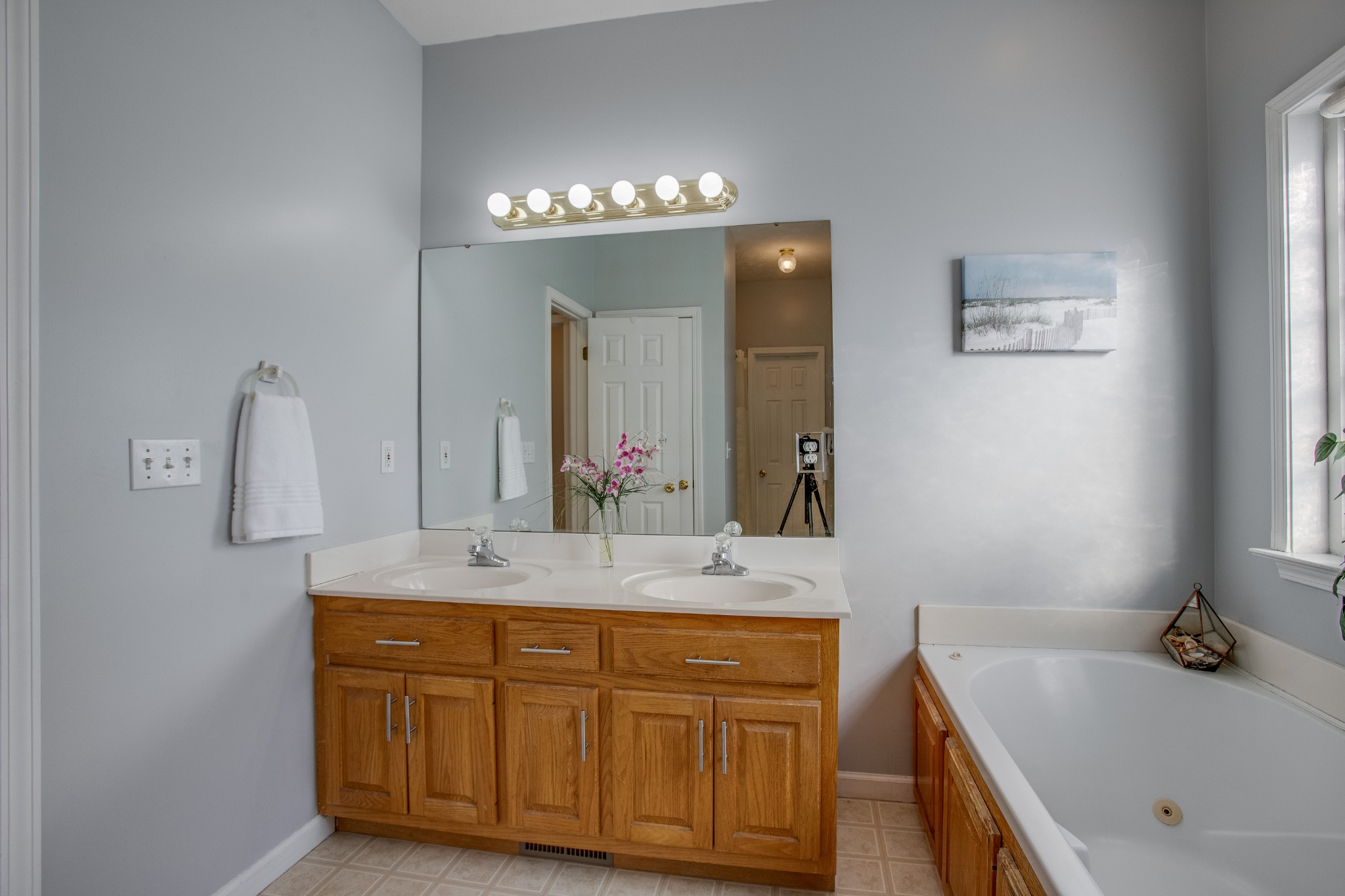 2918 Buckner Lane Spring Hill, TN 37174 - Photo 31 of 54 a bathroom with a tub sink and mirror