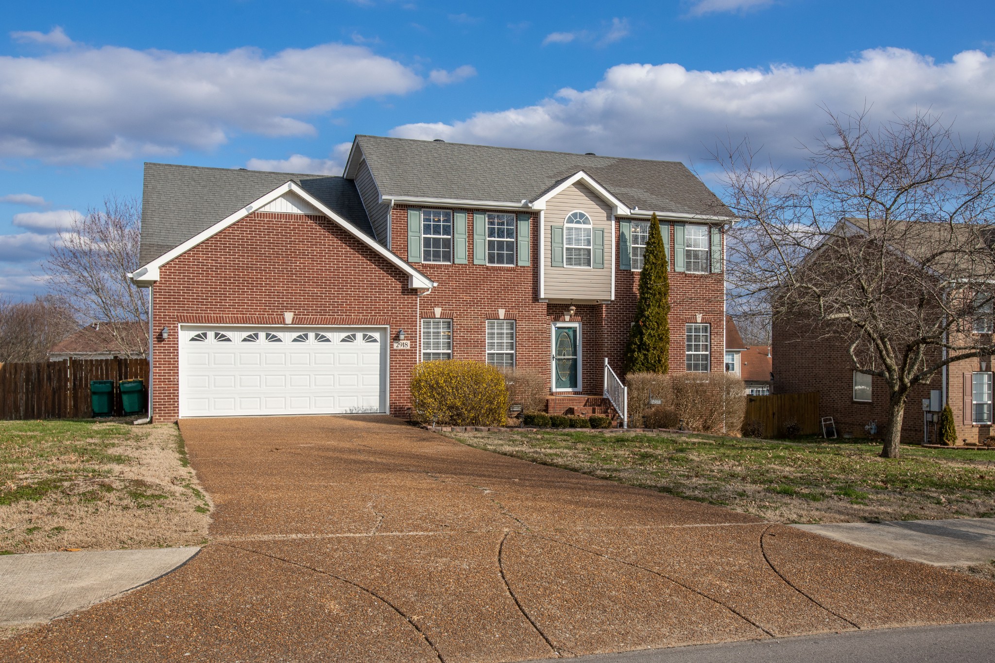 2918 Buckner Lane Spring Hill, TN 37174 - Photo 5 of 54 a front view of a house with a yard and garage