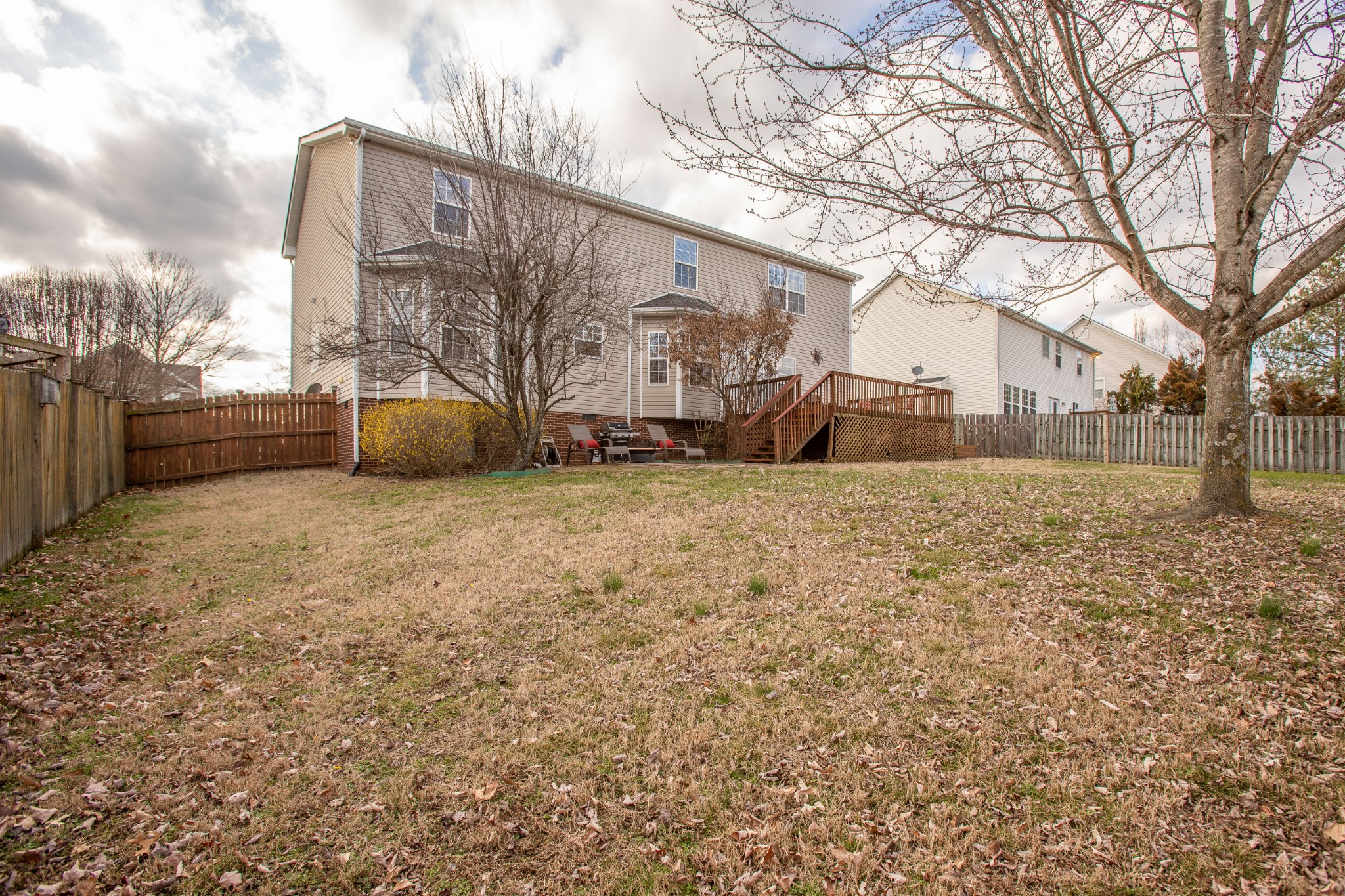 2918 Buckner Lane Spring Hill, TN 37174 - Photo 52 of 54 a view of a blue house with a yard covered in snow