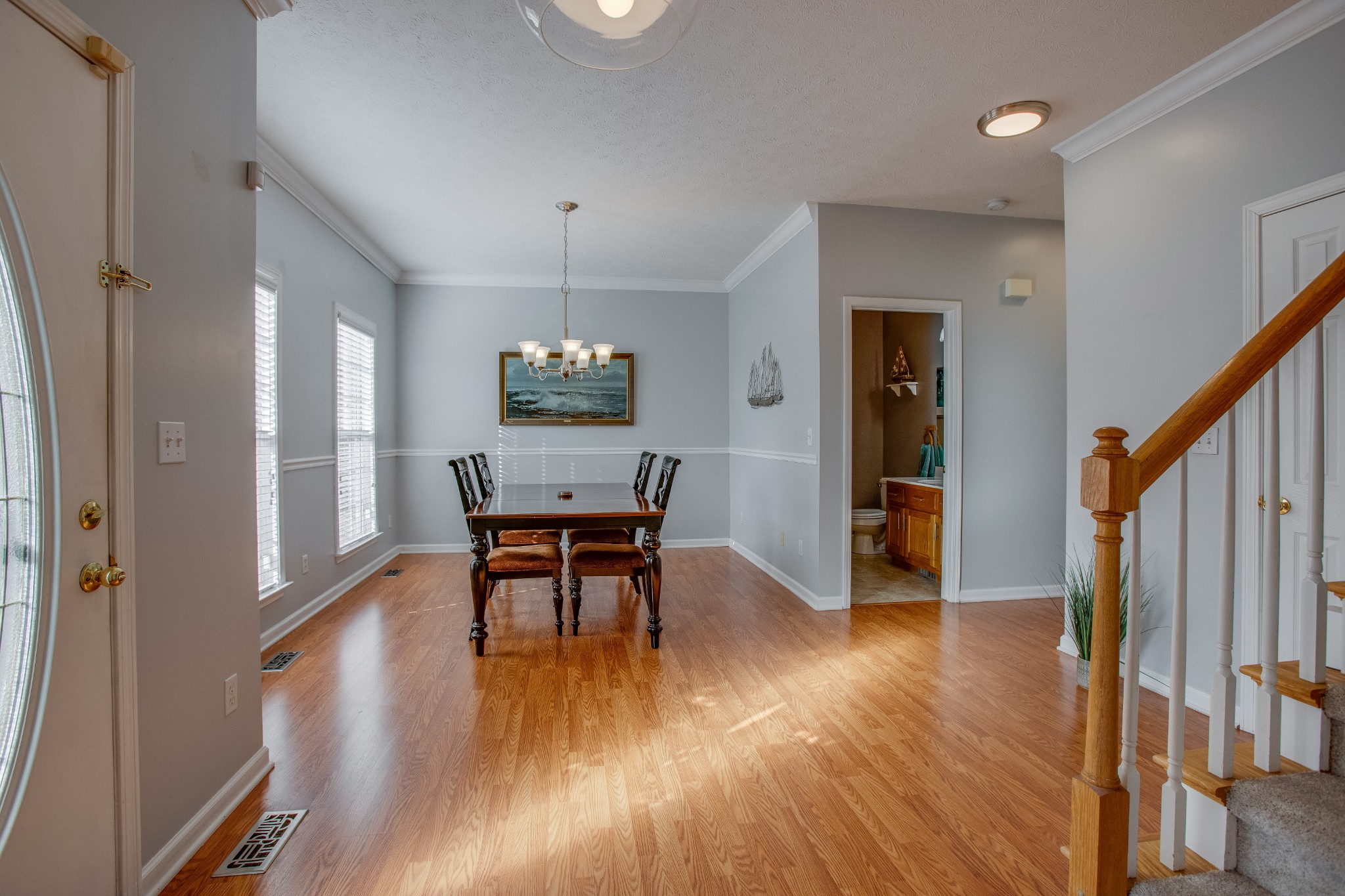 2918 Buckner Lane Spring Hill, TN 37174 - Photo 10 of 54 a view of a dining room with furniture and wooden floor