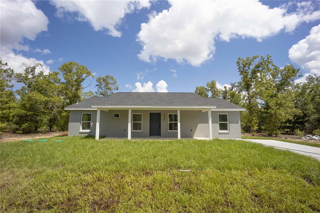 16429 Southeast 115th Place Road Ocklawaha, FL 32179 - Photo 1 of 1 a view of a house with yard and sitting area