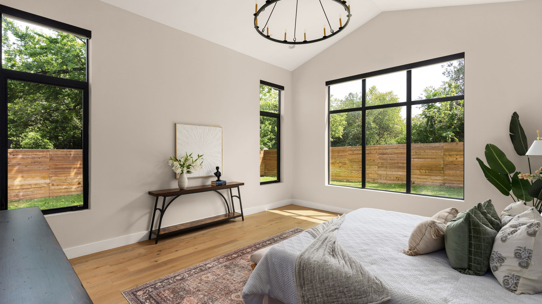 1909 West 40th Street Austin, TX 78731 - Photo 17 of 40 a bedroom with a bed a window and a chandelier