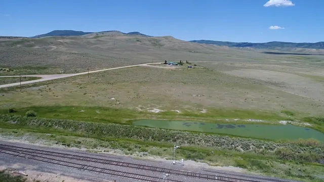 a view of a big yard and an ocean