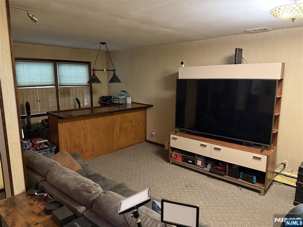36 Lavina Trail Oak Ridge, NJ 07438 - Photo 14 of 26 a room with furniture and flat screen tv