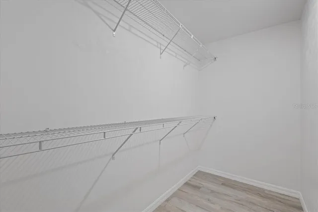 a bathroom with double sink and a mirror