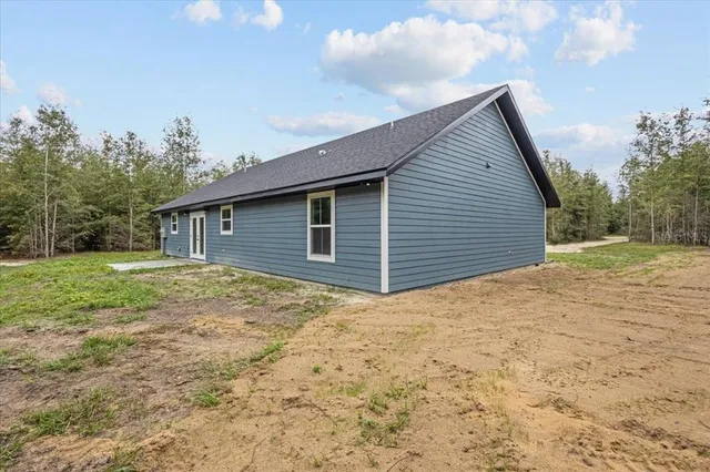 a view of a backyard with a garden