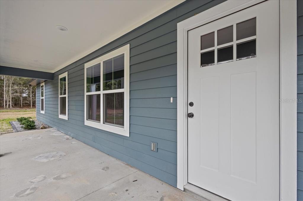 4899 Northwest 36th Street Bell, FL 32619 - Photo 5 of 67 a house view with a outdoor space