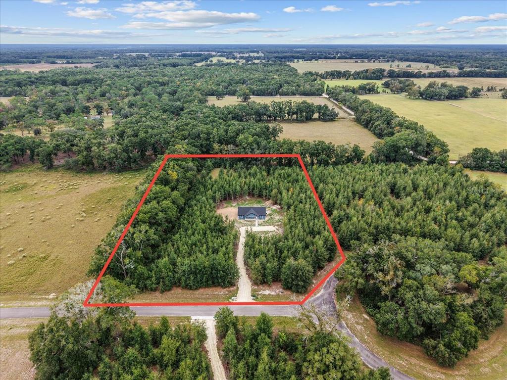 4899 Northwest 36th Street Bell, FL 32619 - Photo 62 of 67 a view of a city and a lake view