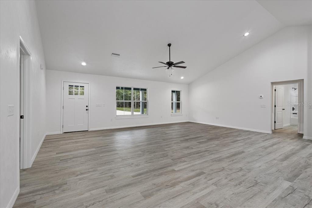 4899 Northwest 36th Street Bell, FL 32619 - Photo 9 of 67 wooden floor in an empty room with a window