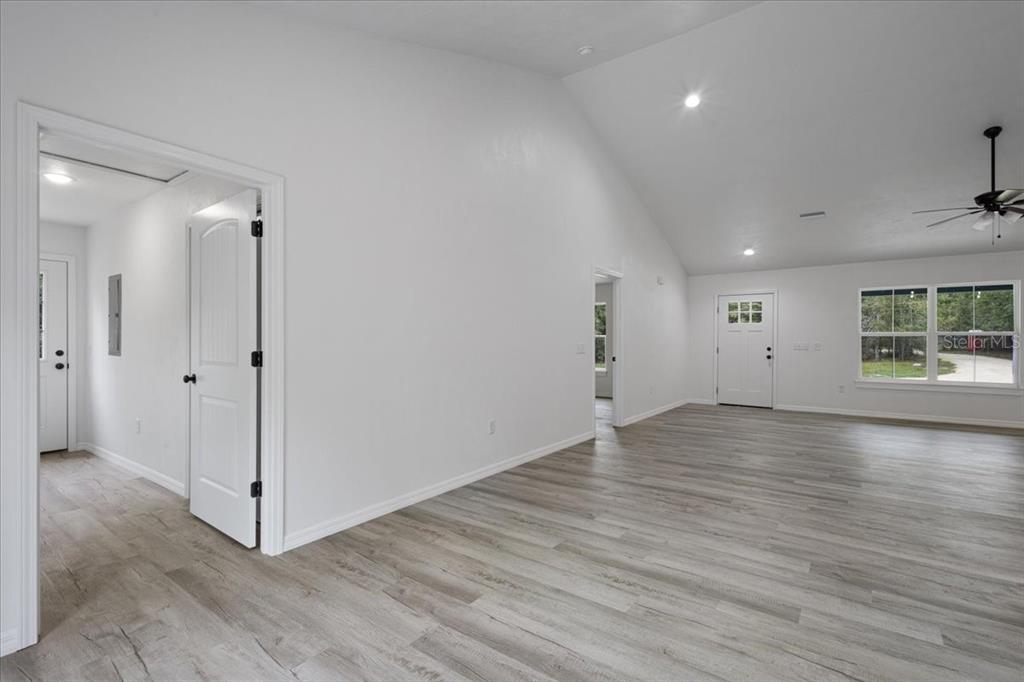 4899 Northwest 36th Street Bell, FL 32619 - Photo 10 of 67 an empty room with wooden floor and windows