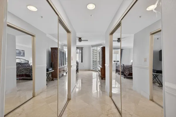 a view of a hallway with living room and furniture