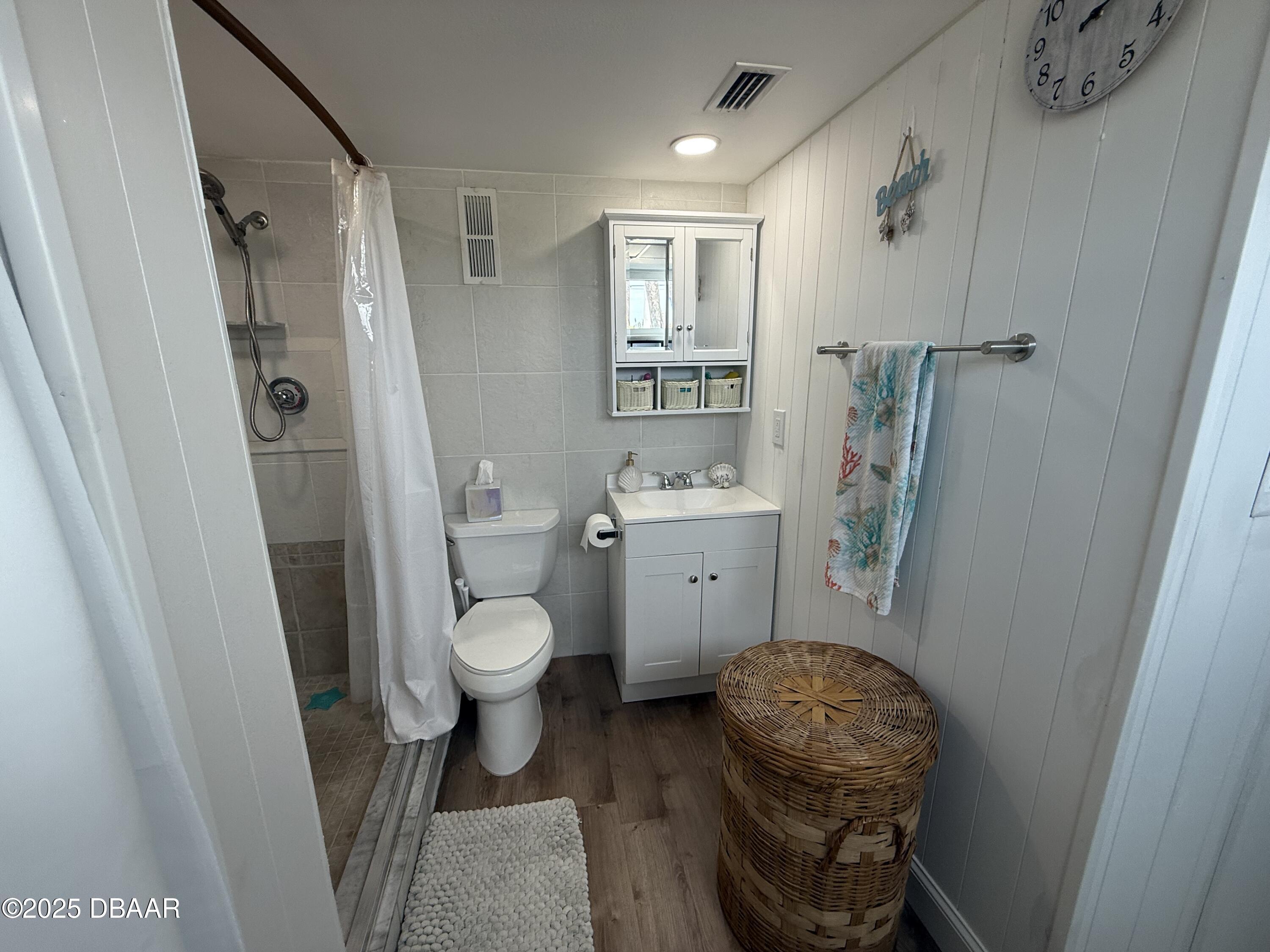 2711 North Halifax Avenue, Unit 288 Daytona Beach, FL 32118 - Photo 17 of 35 a bathroom with a sink toilet and shower
