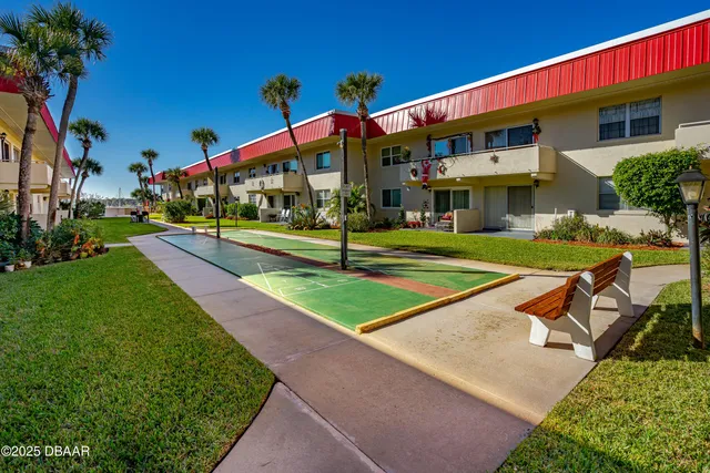 a view of roof deck with a barbeque and wooden stairs