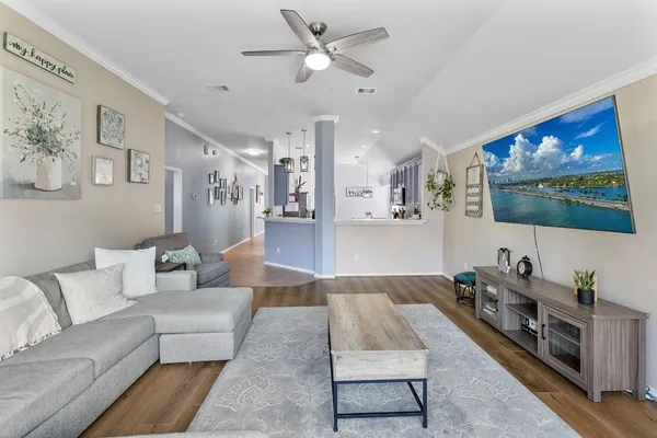 a living room with furniture and a flat screen tv