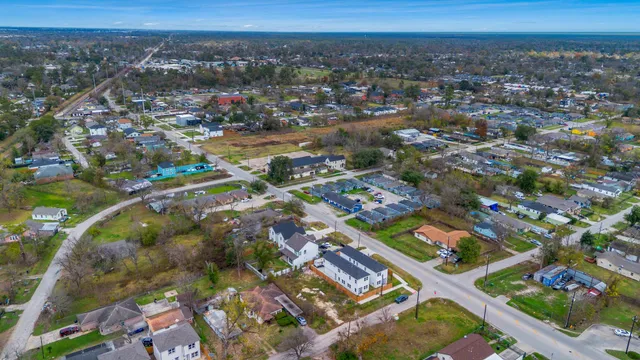 an aerial view of residential building with yard