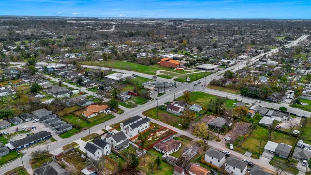 an aerial view of residential building with yard