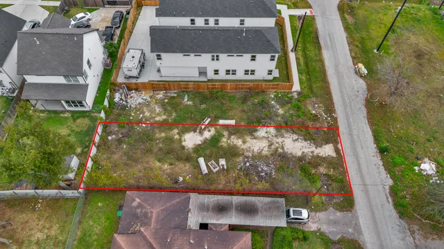 an aerial view of city and lake